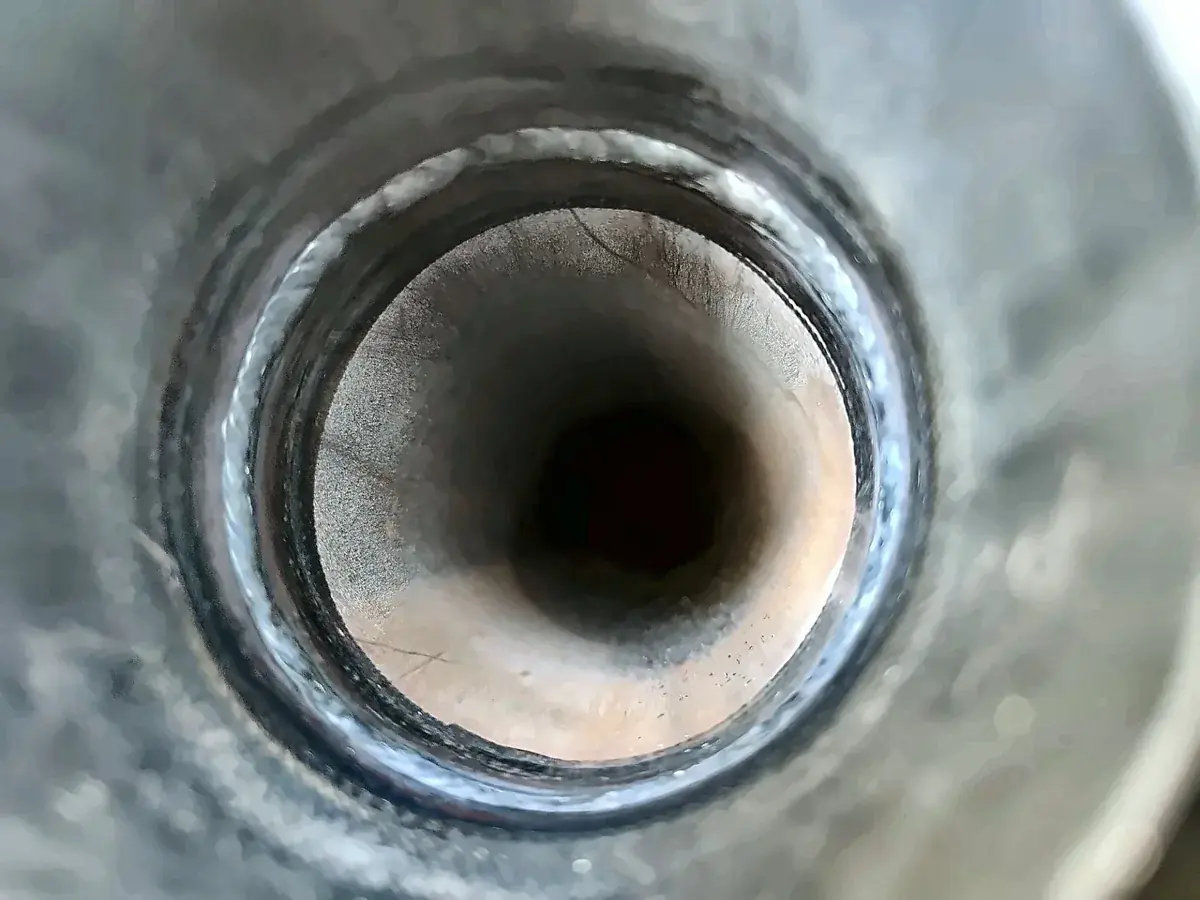 Finished root run on a butt weld, photographed down the pipe bore from the open end of a spool