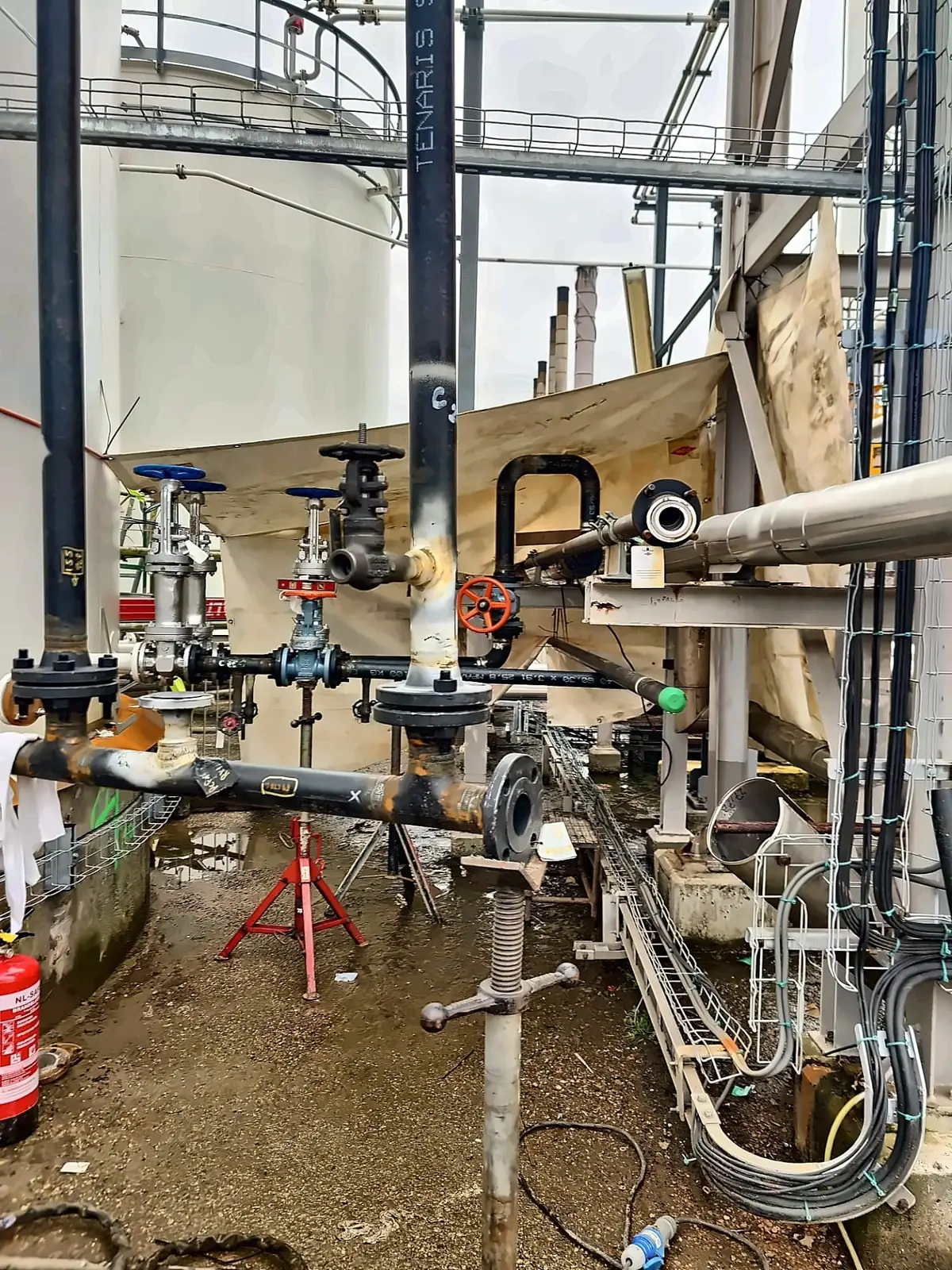 Tie-in piping and flanged joints running from the valve station into the existing rack