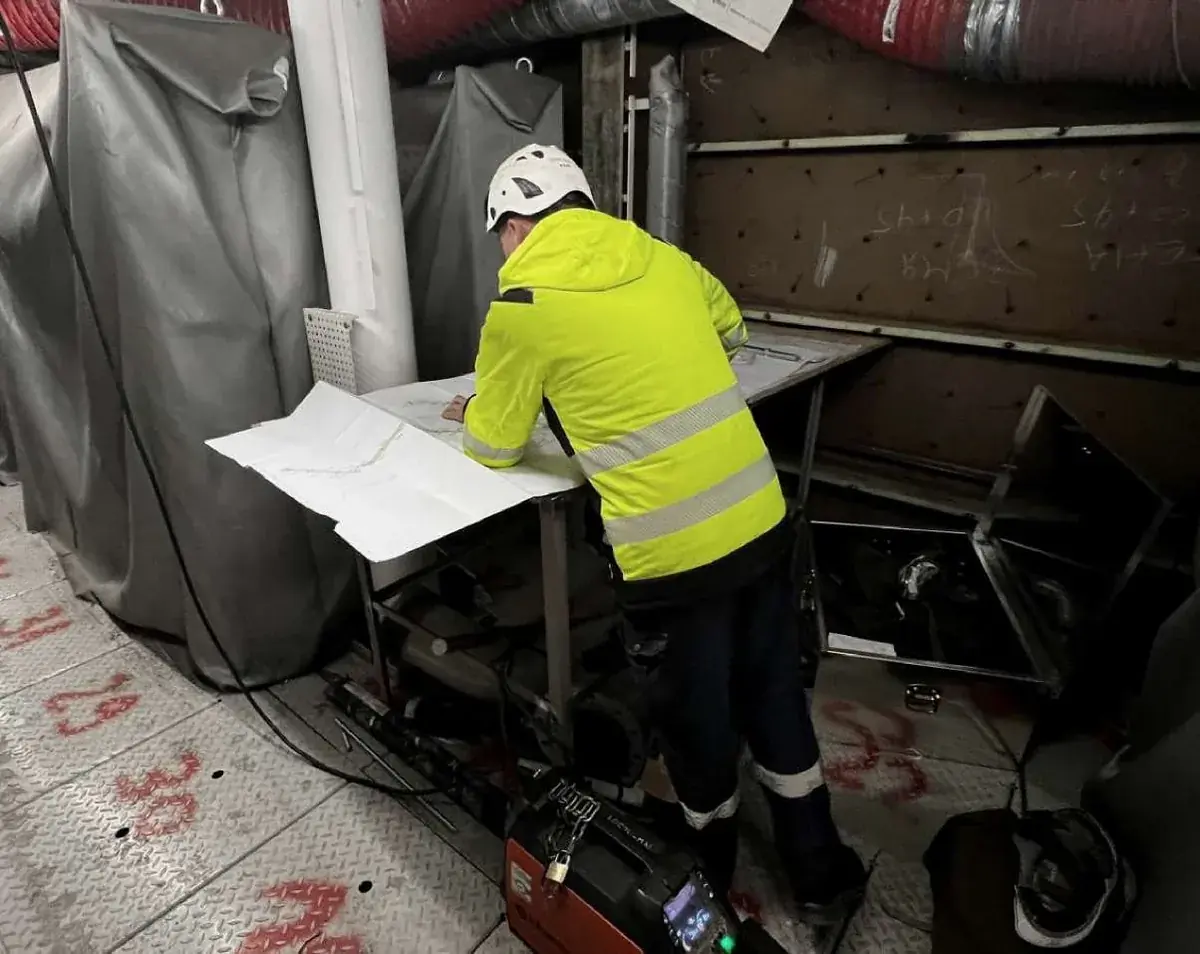 ALPROJECTS engineer working from isometric drawings on site