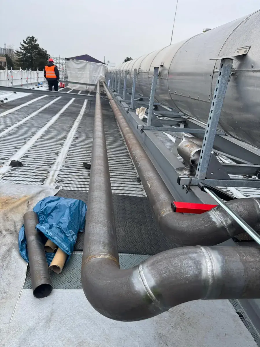 Process lines run alongside insulated ductwork