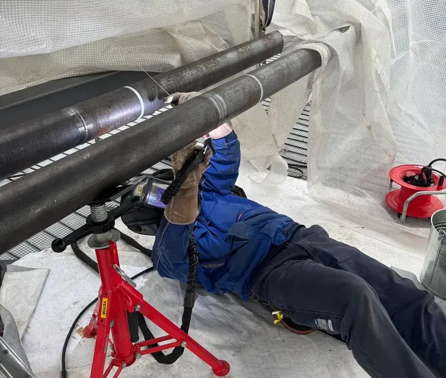 Welder running a TIG root pass on a prefabricated pipe spool