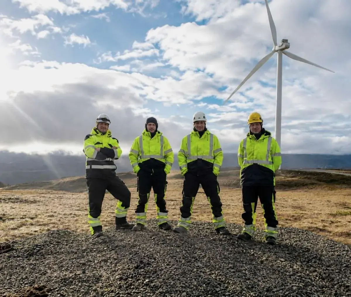 Wind turbine technicians on site at an onshore wind farm